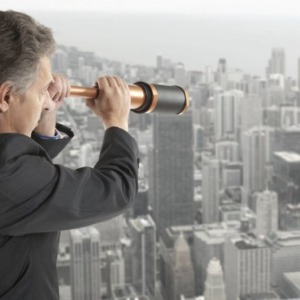 Business concept Business concept. Business man looks through a telescope